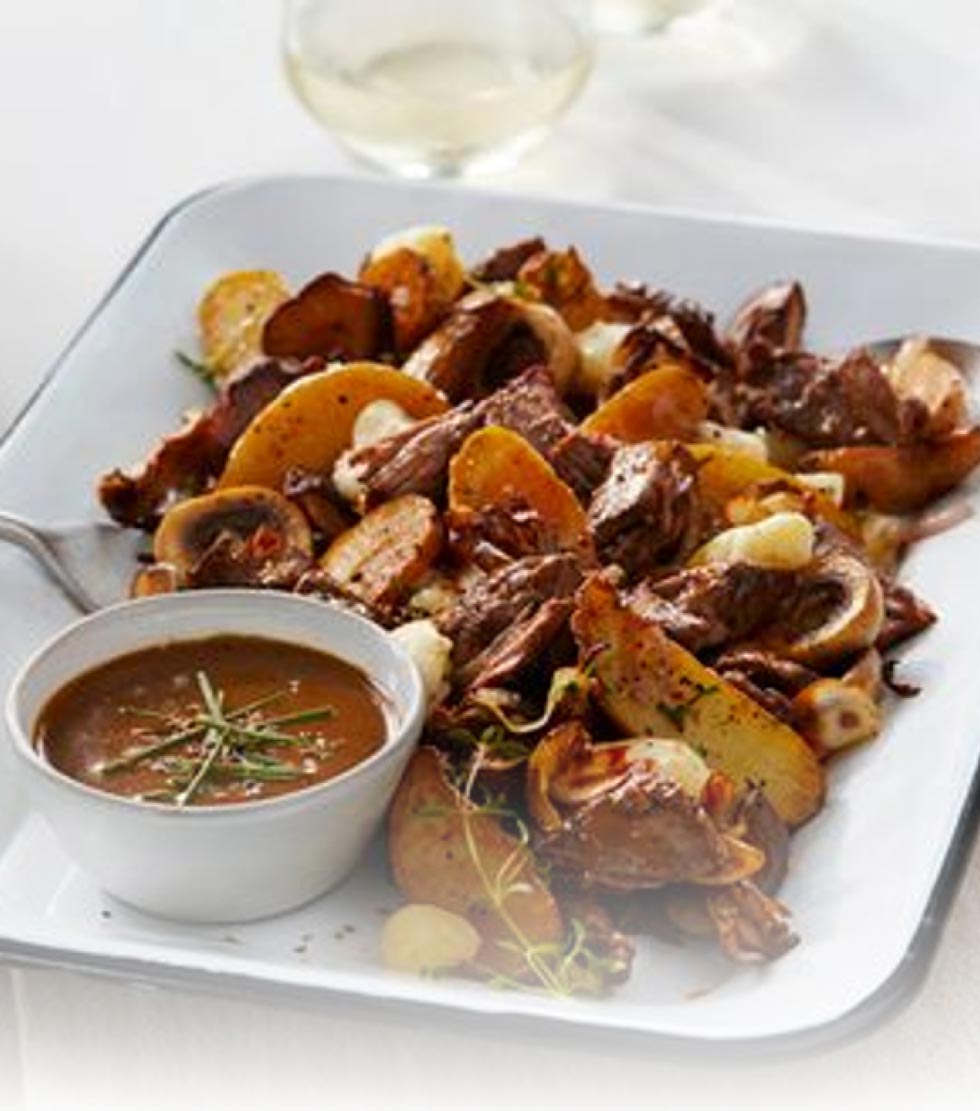 Loaded poutine made with chuck roll, fried fingerling potatoes, fresh cheese curds and sauteed wild mushrooms served with a brown gravy