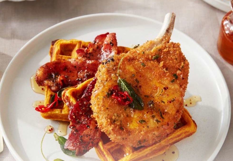 Pork Chop and Waffles – Breaded Pork Chop with Sweet Potato Waffles, Candied Bacon, Hot Honey Drizzle