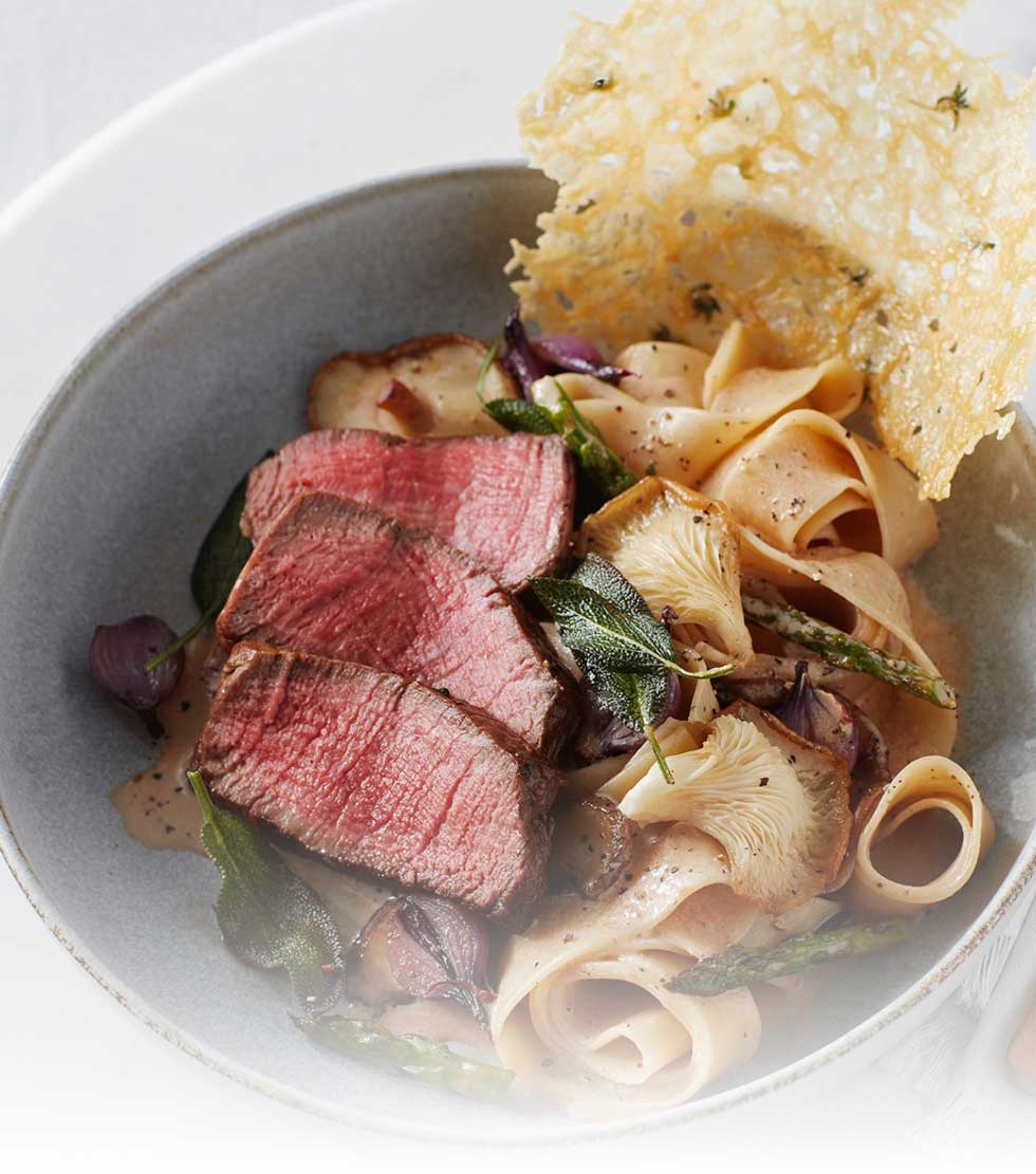 Sage brown butter basted beef tenderloin with pappardelle pasta, oyster mushrooms and Parmesan tuilles